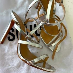 Schultz Silver Strap Heels.